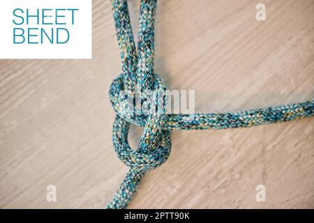 Above shot of hiking rope tied in a knot against a wooden background in  studio. Sheet bend knot, A knot for every situation. Strong rope to secure  Stock Photo - Alamy