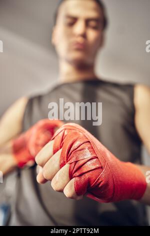 Close-up of Hands of Boxer with Bandage Ready for a Fight Against