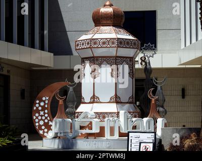 Cairo, Egypt, April 24 2023: festive decorations of Islamic Ramadan fasting month in Egyptian streets at daylight of stars, crescent moon, mosque mina Stock Photo