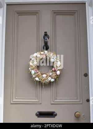 Easter wreath hanging on a door. Stock Photo