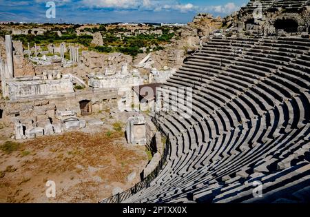 A view from the top of the steep ancient amphitheatre within the Roman city at Side in Antalya Province, Turkey (Turkiye). The amphitheatre, which dat Stock Photo