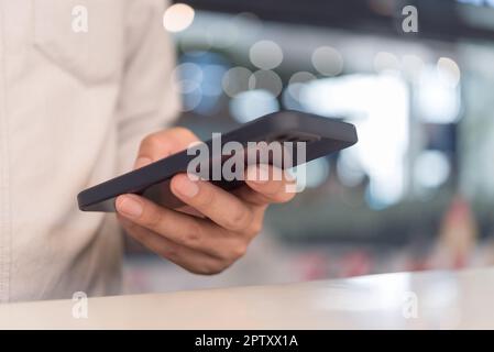 man using mobile smart phone.Digital technology communications concept. Stock Photo