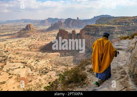 Megab, Ethiopia - January 9, 2018: A priest outside Daniel Korkor Church in Gheralta Mountains, Tigray, Ethiopia. Stock Photo