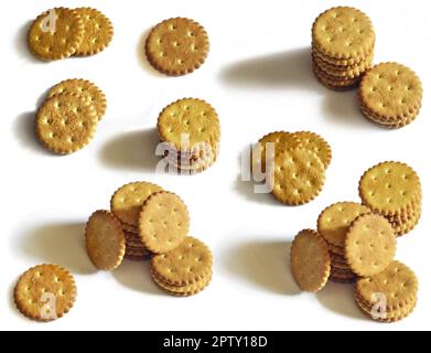 Classic round golden yellow salted cracker isolated on over white background Stock Photo