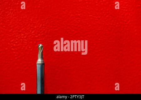 CNC tool ball or endmill ball dilapidated and red background Stock Photo