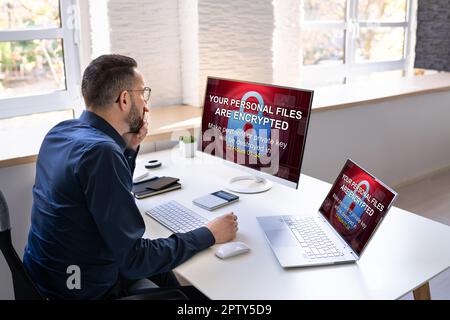 Ransomware Cyber Attack Showing Personal Files Encrypted Screen Stock Photo