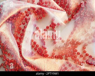 Beautiful fabric - taffeta, gently folded in waves. Crumpled material that looks like silk or brocade. Overflow and color gradient at different lighti Stock Photo