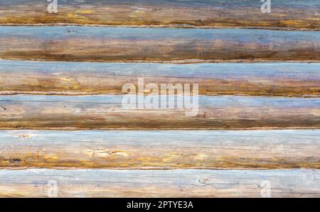 A full frame of a farmhouse wall made from oak logs. Rural, garden, country. Stock Photo