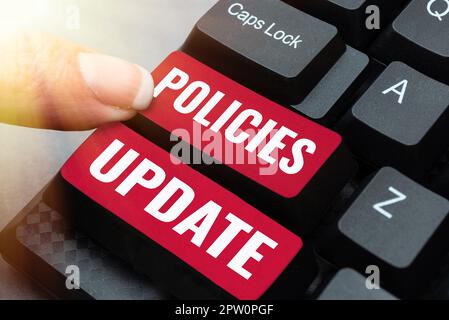 Text caption presenting Policies Update, Word for act of adding new information or guidelines formulated Stock Photo