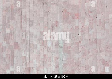 Background texture of old matte beige marble wall from a variety of large tiles Stock Photo