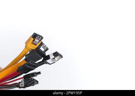 Red, black and yellow data cables on white background. Data storage, network server infrastructure concept. Plenty of negative space. Stock Photo