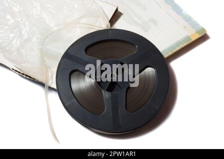 reel-to-reel tape spool with carton box on white background Stock
