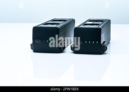 Drone LiPo battery on white background. Rechargeable battery of drone aircraft with digital camera. Lithium polymer battery used to power UAV. Lithium Stock Photo