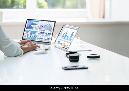 Analyst Employee Working With Spreadsheet Report On Laptop Screen Stock Photo