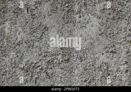 Texture of the old embossed concrete wall in gray color. Background image of a concrete product Stock Photo