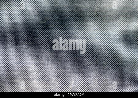 closeup of texture breathable mesh fabric in the black photo backpack. Texture of Black Plastic Weave Bag. Background image Stock Photo