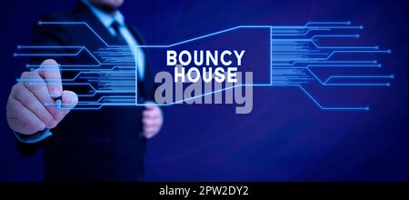 Sign displaying Bouncy House, Word for Automated program that runs over the Internet Artificial intelligence Stock Photo