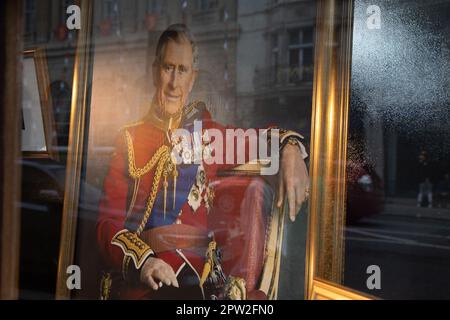 London, UK. 28th Apr 2023. An image of King Charles III is displayed in a shop window, ahead of his coronation on May 6th, 2023. Credit: Kiki Streitberger /Alamy Live News Stock Photo