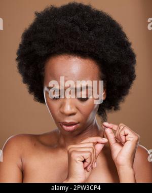 Hair loss, stress and black woman feeling anxious about hairstyle damage and dry hair care. Hair style, afro and split end control problem of a woman Stock Photo