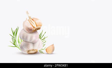 Stack of organic garlic, garlic cloves and dill on a light light gray background. Tower of spicy root vegetables. Equilibrium floating food balance. Stock Photo