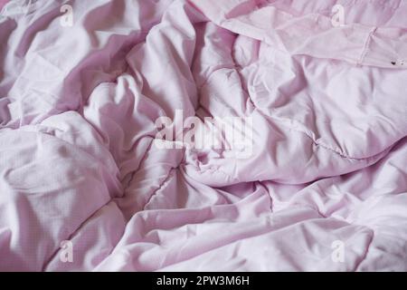 Bed with messy pick color Blankets, Stock Photo