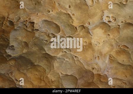 Combination of stone relief like a orange planet surface. Brown stone with abnormal relief shape with specific light Stock Photo