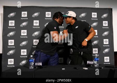 Philadelphia Eagles' Jalen Carter hands his jersey over to a member of the  Military during practice at NFL football training camp, Sunday, July 30,  2023, in Philadelphia. (AP Photo/Chris Szagola Stock Photo 