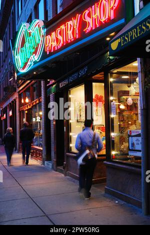 An adult man walks into Modern Pastry Shop, a Landmark bakery  in Boston's Italian North End Stock Photo