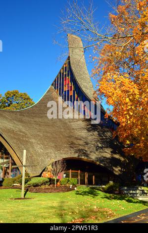 The Modern United Church in Rowayton, Connecticut, near Darien, is surrounded by brilliant autumn color Stock Photo