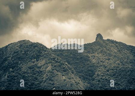 Old black and white picture of Abraao mountain Pico do Papagaio with clouds on Ilha Grande Angra dos Reis Rio de Janeiro Brazil. Stock Photo
