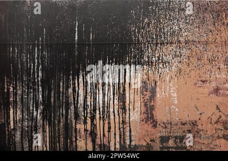 Rusty metal texture with scratched surface. Old painted metal wall with peeling paint. Texture obsolete painting metal fence close-up Stock Photo