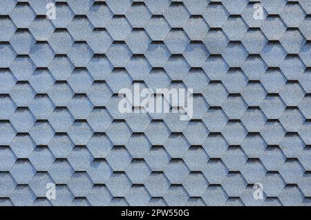 Modern roofing and decoration of chimneys. Flexible bitumen or slate shingles in hexagon shape. Top view texture Stock Photo