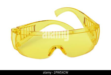 Yellow plastic protective goggles for workers on a white isolated background Stock Photo