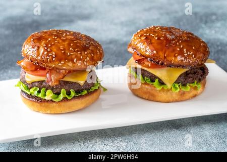 Two hamburgers on the plate close up Stock Photo