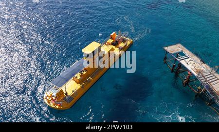 Coral 2000 boat in Coral Beach Nature Reserve . Tourist Yellow boat in Eilat, Israel. Stock Photo