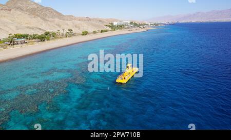 Coral 2000 boat in Coral Beach Nature Reserve . Tourist Yellow boat in Eilat, Israel. Stock Photo