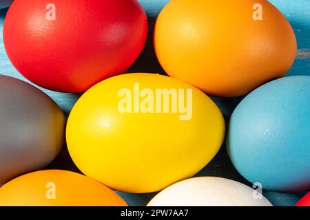 eggs painted in different colors to symbolize the passage of Christian Easter Stock Photo