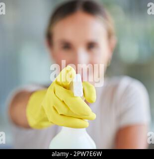 Hand, spray bottle and cleaning with a woman in gloves for housework or sanitization for hygiene. Hands, latex and disinfectant with a female cleaner Stock Photo
