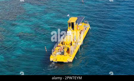 Coral 2000 boat in Coral Beach Nature Reserve . Tourist Yellow boat in Eilat, Israel. Stock Photo