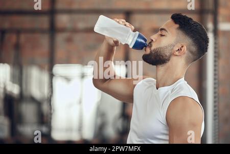 Fit Strong And Workout Break And Water Bottle With A Man Ready To Drink  Water On A Grey Studio Background Bodybuilder Drinking Water And Exercise  Or Training Break For Thirsty Hydration Stock