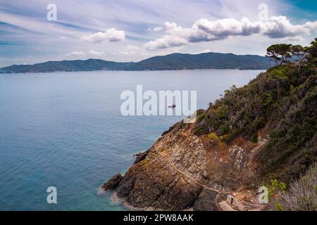 Pathway with small steps carved in stone to little Crocetta beach, situated near Marciana Marina, Elba island, Italy Stock Photo