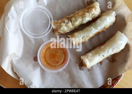Spring rolls with sauce in Vietnamese restaurant Stock Photo
