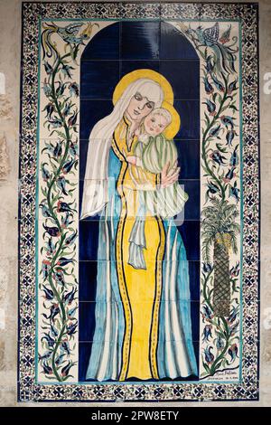 Jerusalem, Israel - November 12th, 2022: An armenian tile art picture of Mary and baby Jesus, placed on a wall in the armenian quarter, Jerusalem, Isr Stock Photo