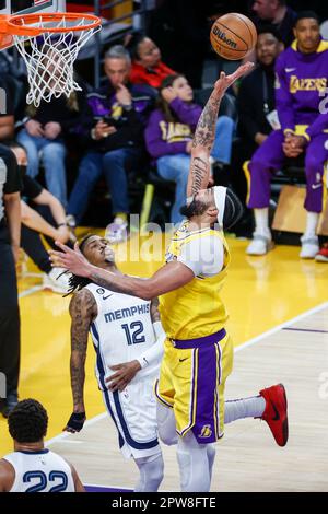 Memphis Grizzlies guard Ja Morant, top, looks to pass over Indiana ...