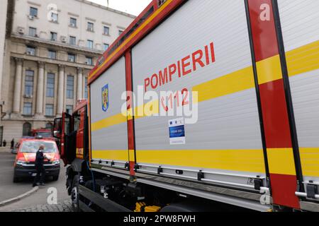 Bucharest, Romania - April 28, 2023: Romanian firefighters along firefighter engines during a public presentation of the trucks. Stock Photo