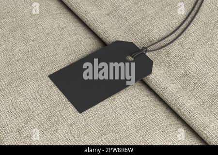 Black tag mockup on fabric background. Side view Stock Photo