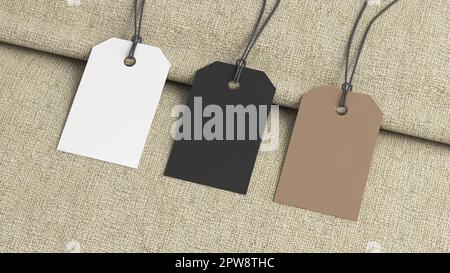 White, cardboard, black tags mockup on fabric background. Side view Stock Photo