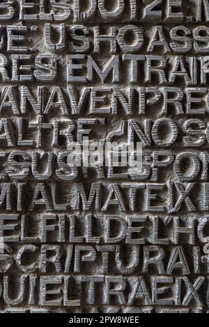 metallic ancient latin letters background texture (illegible inscriptions) Stock Photo