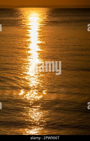 Streak of sunlight going across the Bristol channel Stock Photo