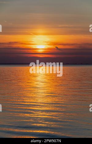 Streak of sunlight going across the Bristol channel Stock Photo